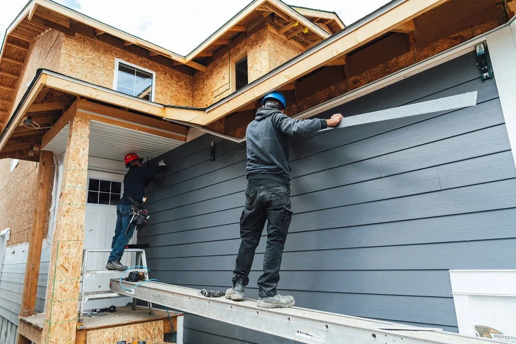 Siding specialist at work